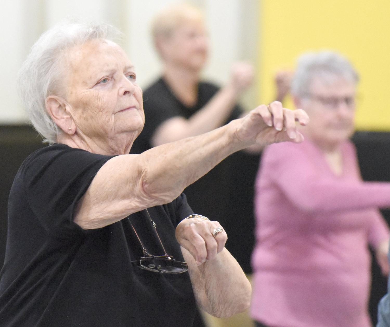 Exercises in the senior fitness class at the Lone Tree Wellness Center includes one with a boxing motion.